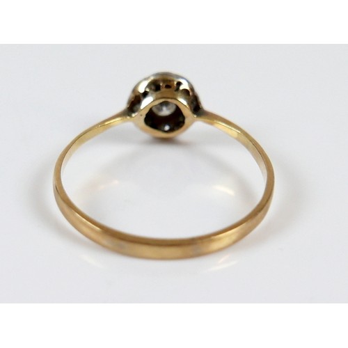 41 - An Edwardian 18ct yellow gold ring, set with nine diamonds in the form of a flowerhead, central ston... 