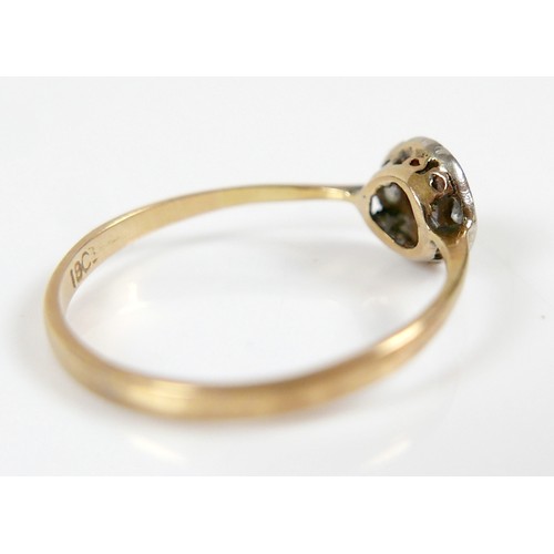 41 - An Edwardian 18ct yellow gold ring, set with nine diamonds in the form of a flowerhead, central ston... 
