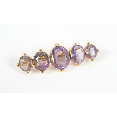 45 - Two yellow metal brooches consisting d a pearl crescent brooch and a five stone amethyst brooch 4.5c... 