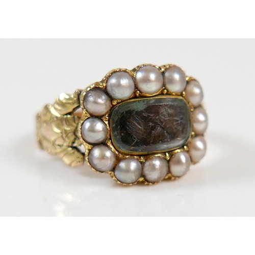 46 - A 19th century yellow metal and pearl mourning ring surface tests to approximately 18ct, head size 1... 