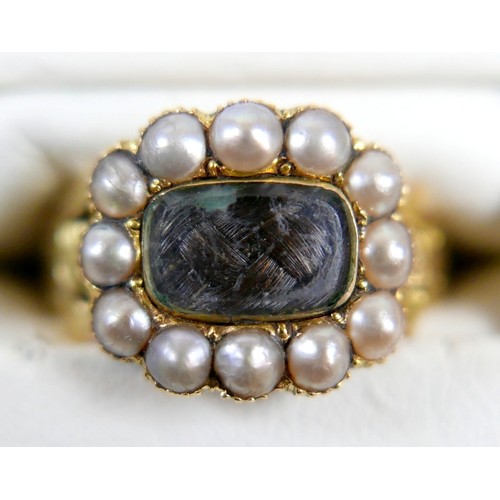 46 - A 19th century yellow metal and pearl mourning ring surface tests to approximately 18ct, head size 1... 
