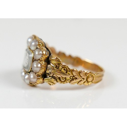 46 - A 19th century yellow metal and pearl mourning ring surface tests to approximately 18ct, head size 1... 