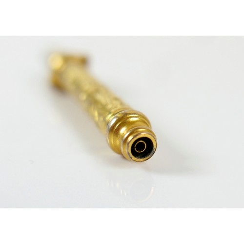 48 - An interesting gilt metal fob whistle/pencil, acanthus engraved decoration, 6.5cm long, 11.1g.