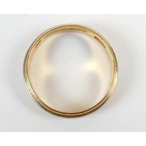 49 - A 22ct yellow and white metal banded ring size M, 4mm band, 3.1g.