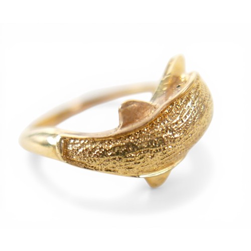 51 - A gold dolphin ring, with indistinct markings, size M, 4.0g.