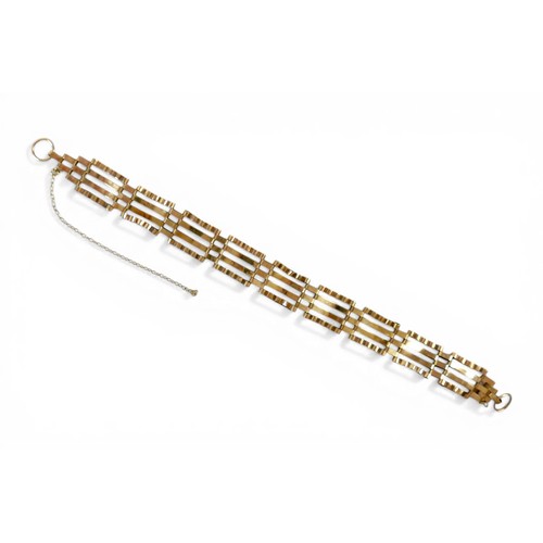 54 - A 9ct gold gate link bracelet, 19cm by 1.4cm, 7.5g.
