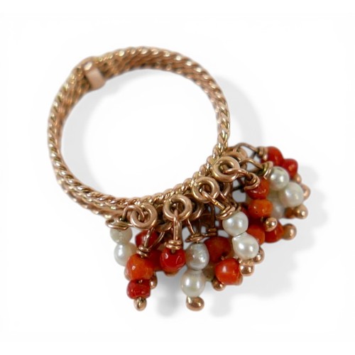 59 - An Egyptian gold coral and pearl ring marks for 18ct, size M, total weight 4.7g.