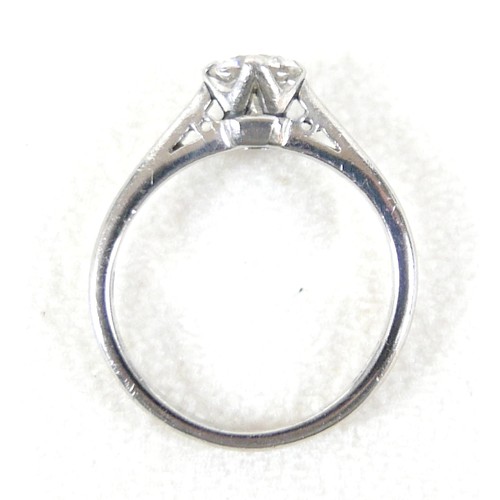 20 - A platinum and diamond solitaire ring, the brilliant cut stone approx 0.6ct, size K, 4.3g.