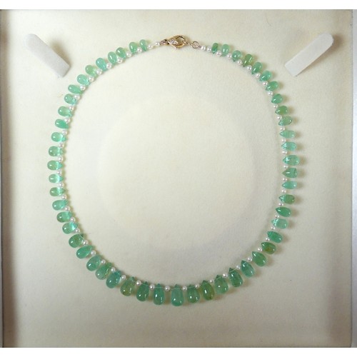 17 - An emerald and pearl necklet, made by Heidi Kjeldsen, Oakham, consisting of fifty five graduating po... 