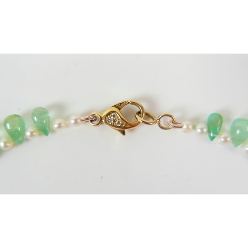 17 - An emerald and pearl necklet, made by Heidi Kjeldsen, Oakham, consisting of fifty five graduating po... 