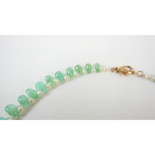 17 - An emerald and pearl necklet, made by Heidi Kjeldsen, Oakham, consisting of fifty five graduating po... 