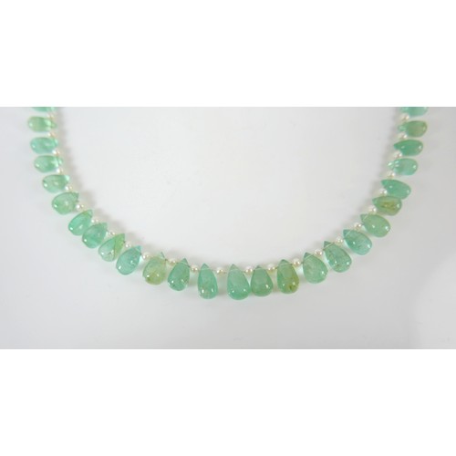 17 - An emerald and pearl necklet, made by Heidi Kjeldsen, Oakham, consisting of fifty five graduating po... 