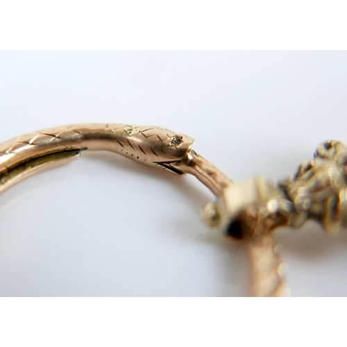 15 - A collection of five yellow metal fobs a serpent ring, four are intaglio, largest fob 16 by 14 by 24... 