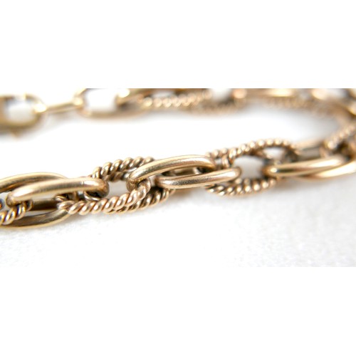 16 - A 9ct gold fancy link bracelet, 22.5cm long, 21.2g.