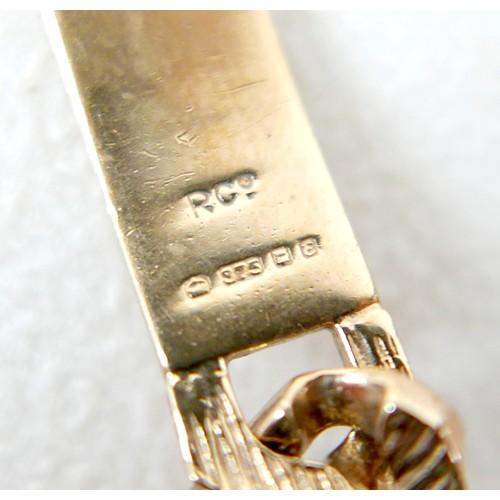 13 - A 9ct gold identity bracelet, with flat curb link, bark effect chain, blank identity tag, 20.5cm lon... 