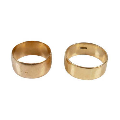 12 - Two yellow gold band rings comprising an 18ct ring size S/T, 7.5mm band, 6.7g, and another size O, 9... 