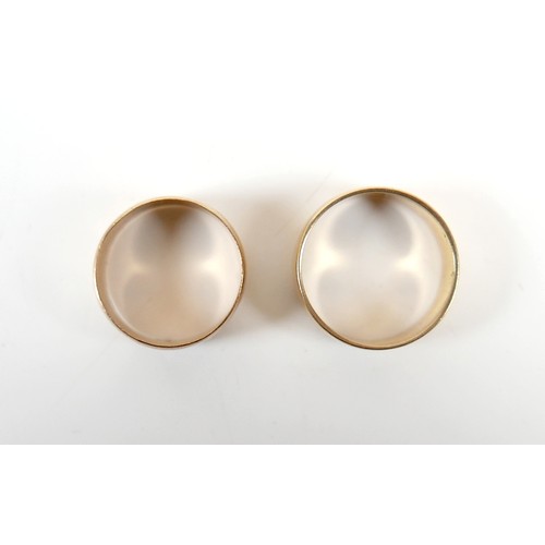 12 - Two yellow gold band rings comprising an 18ct ring size S/T, 7.5mm band, 6.7g, and another size O, 9... 