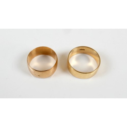 12 - Two yellow gold band rings comprising an 18ct ring size S/T, 7.5mm band, 6.7g, and another size O, 9... 