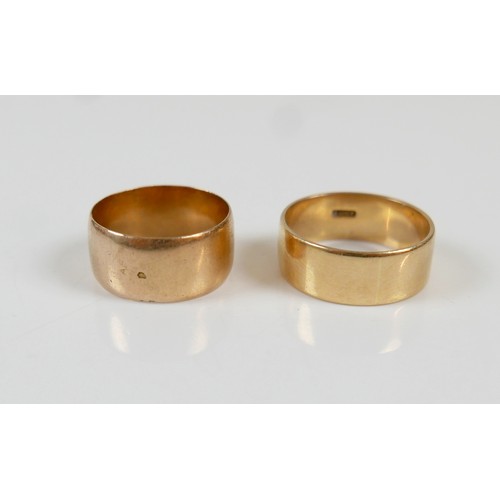 12 - Two yellow gold band rings comprising an 18ct ring size S/T, 7.5mm band, 6.7g, and another size O, 9... 