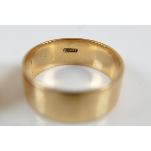 12 - Two yellow gold band rings comprising an 18ct ring size S/T, 7.5mm band, 6.7g, and another size O, 9... 