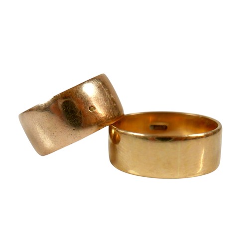 12 - Two yellow gold band rings comprising an 18ct ring size S/T, 7.5mm band, 6.7g, and another size O, 9... 