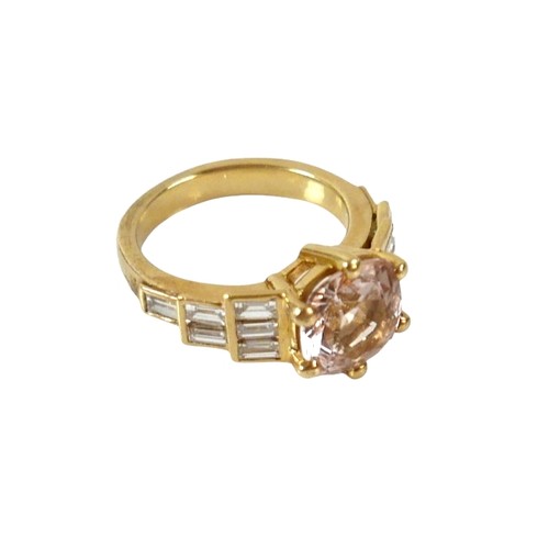 8 - A yellow gold Beryl Morganite and diamond ring set with a central cushion cut stone measuring approx... 