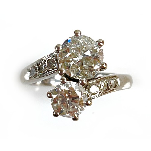 1 - An 18ct white gold and diamond crossover ring, 'Toi et Moi', made by Heidi Kjeldsen of Oakham using ... 