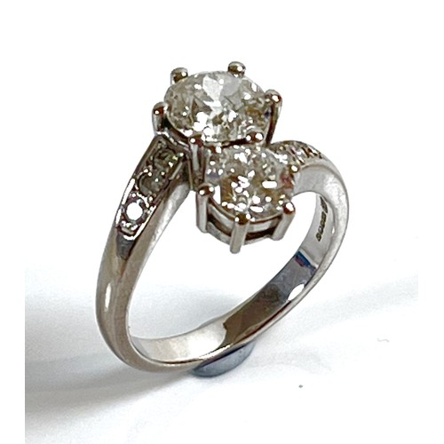 1 - An 18ct white gold and diamond crossover ring, 'Toi et Moi', made by Heidi Kjeldsen of Oakham using ... 