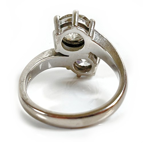 1 - An 18ct white gold and diamond crossover ring, 'Toi et Moi', made by Heidi Kjeldsen of Oakham using ... 