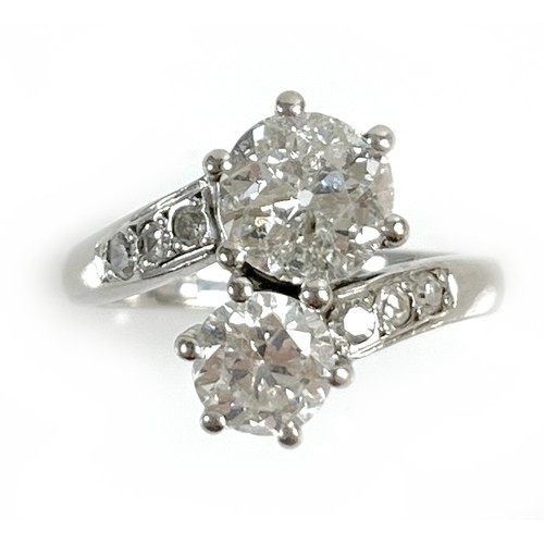 1 - An 18ct white gold and diamond crossover ring, 'Toi et Moi', made by Heidi Kjeldsen of Oakham using ... 