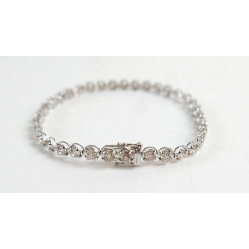 4 - A diamond and platinum tennis bracelet, set with thirty five round cut diamonds, each approx 4.2mm, ... 