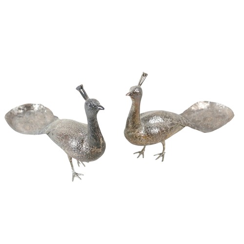218 - A fine and large pair of Art Deco Hanau silver table models of peacocks, each in standing pose with ... 