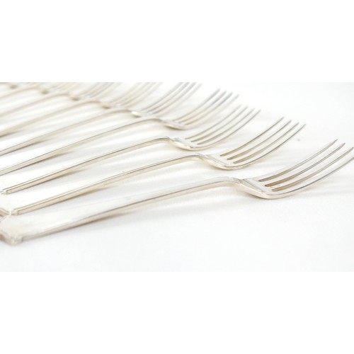 219 - An Elizabeth II silver suite of cutlery, by Elkington & Co, comprising four tablespoons, 21.7cm long... 