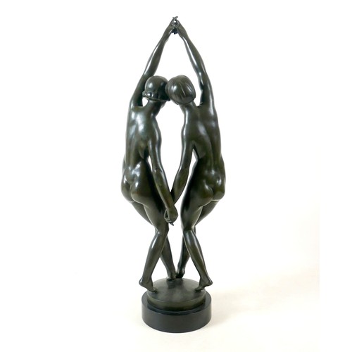 268 - A large French bronze of two nude girls dancing signed P Duberry standing on a round black marble ba... 