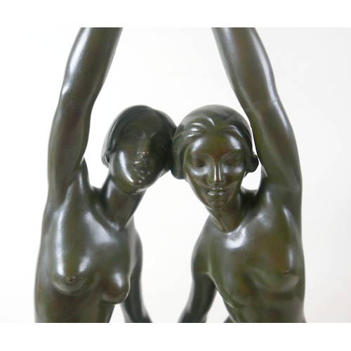 268 - A large French bronze of two nude girls dancing signed P Duberry standing on a round black marble ba... 