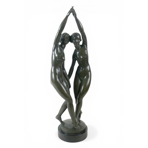 268 - A large French bronze of two nude girls dancing signed P Duberry standing on a round black marble ba... 