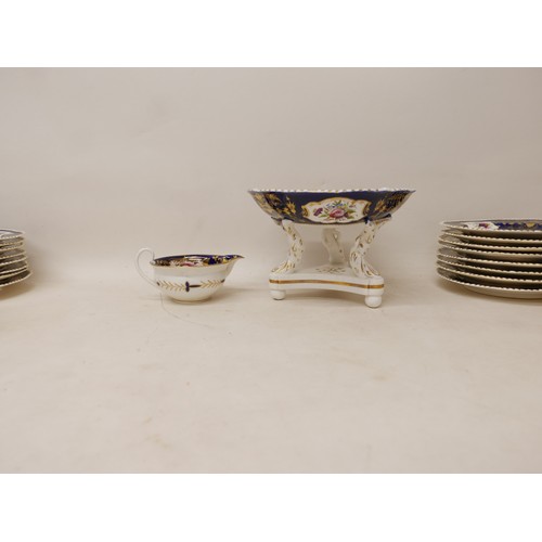 381 - An extensive early 19th century Derby dessert service painted with panels of floral sprays within gi... 