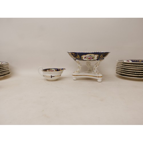 381 - An extensive early 19th century Derby dessert service painted with panels of floral sprays within gi... 