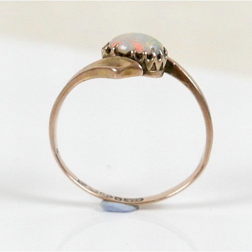 39 - A 9ct yellow gold ring, set with an oval opal, 7 by 5mm, size P, 1.9g.