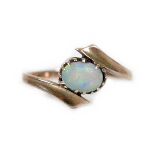 39 - A 9ct yellow gold ring, set with an oval opal, 7 by 5mm, size P, 1.9g.