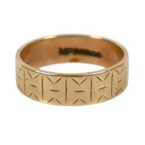 38 - A 9ct yellow gold band ring, with engraved decoration, 5.5mm wide, size N, 2.96g.