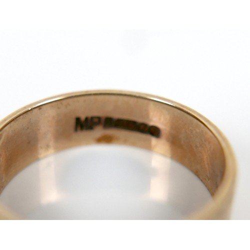 38 - A 9ct yellow gold band ring, with engraved decoration, 5.5mm wide, size N, 2.96g.