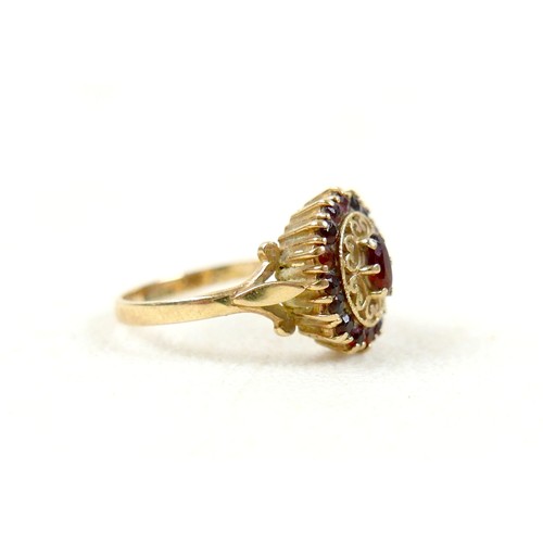 27 - A 9ct gold garnet cluster ring, size O, 2.8g.