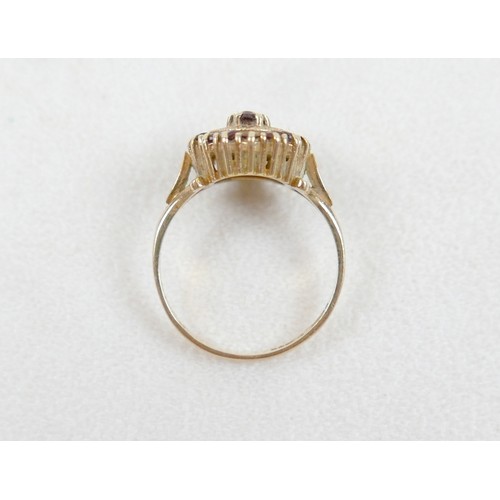 27 - A 9ct gold garnet cluster ring, size O, 2.8g.
