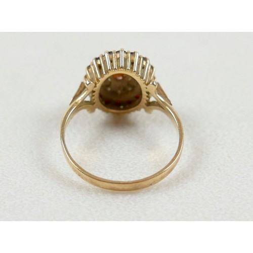 27 - A 9ct gold garnet cluster ring, size O, 2.8g.