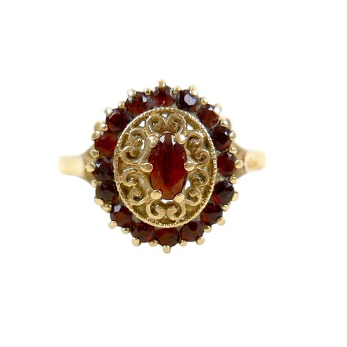 27 - A 9ct gold garnet cluster ring, size O, 2.8g.