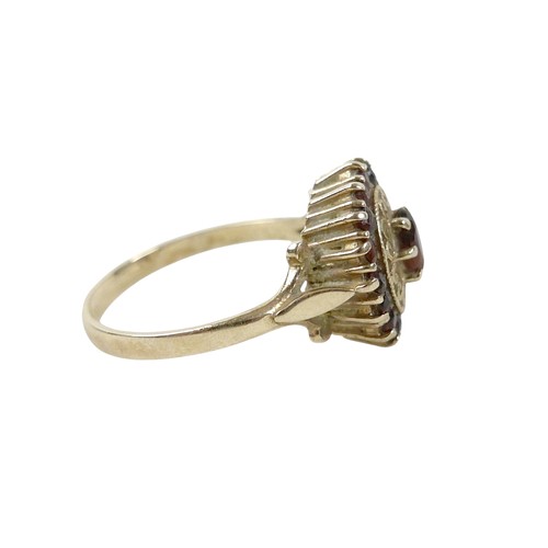 27 - A 9ct gold garnet cluster ring, size O, 2.8g.