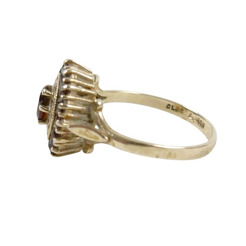 27 - A 9ct gold garnet cluster ring, size O, 2.8g.