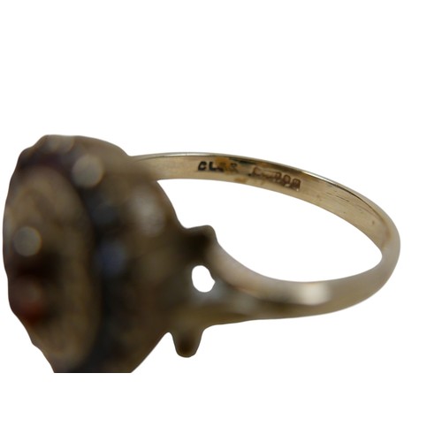 27 - A 9ct gold garnet cluster ring, size O, 2.8g.