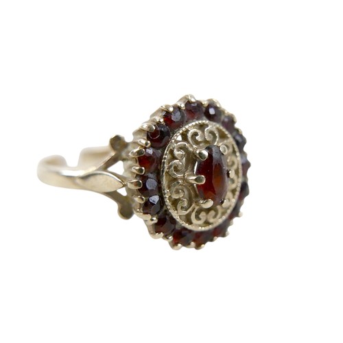 27 - A 9ct gold garnet cluster ring, size O, 2.8g.